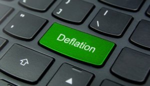 Business Concept: Close-up the Deflation button on the keyboard and have Lime, Green color button isolate black keyboard