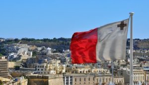 Maltese flag and cityscape