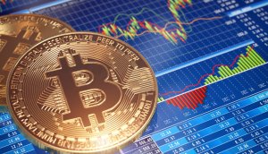 bitcoin-münze-vor-einer-chart
