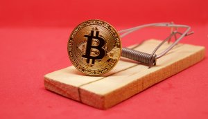 Bitcoin münze als Käder in einer Mausefalle