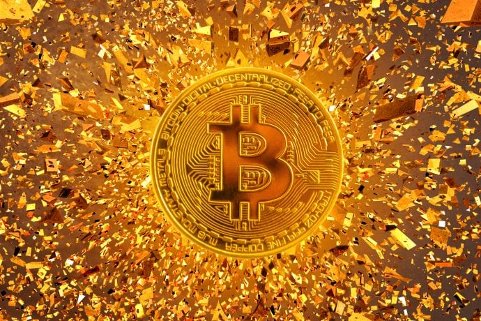 Bitcoin Münze und Goldsplitter