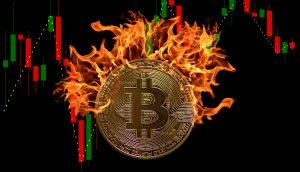 bitcoin-münze vor Bitcoin-Kurs-Chart